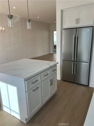 a kitchen with a refrigerator a sink and a dishwasher