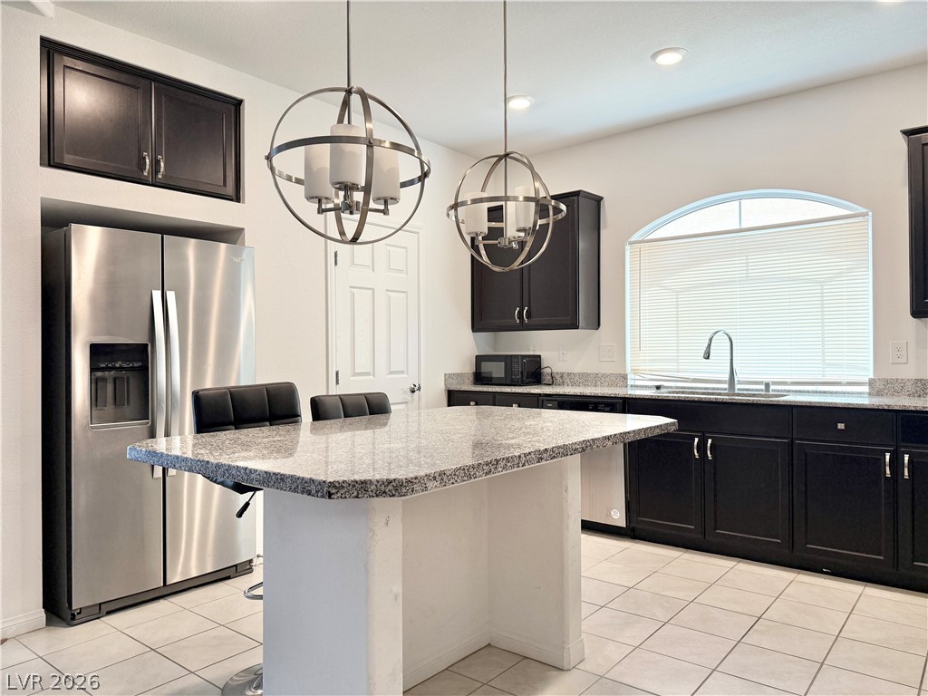 7777 South Westwind Road Las Vegas, NV 89139 - Photo 23 of 46 A well-appointed kitchen features ample counter space, rich cabinetry, and sleek stainless steel appliances.