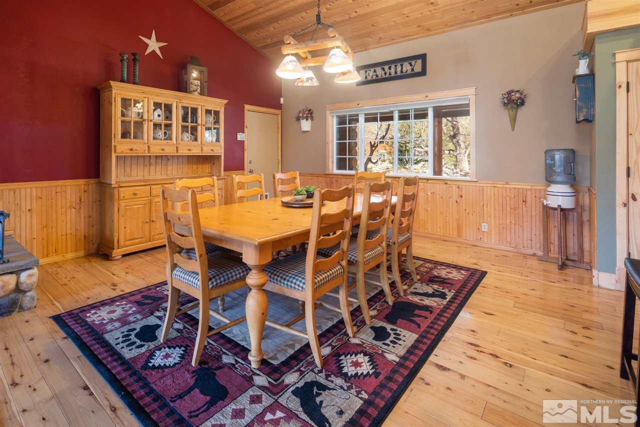 345 Prickly Pear Road Verdi, NV 89439 - Photo 11 of 26 a view of a dining room with furniture and wooden floor