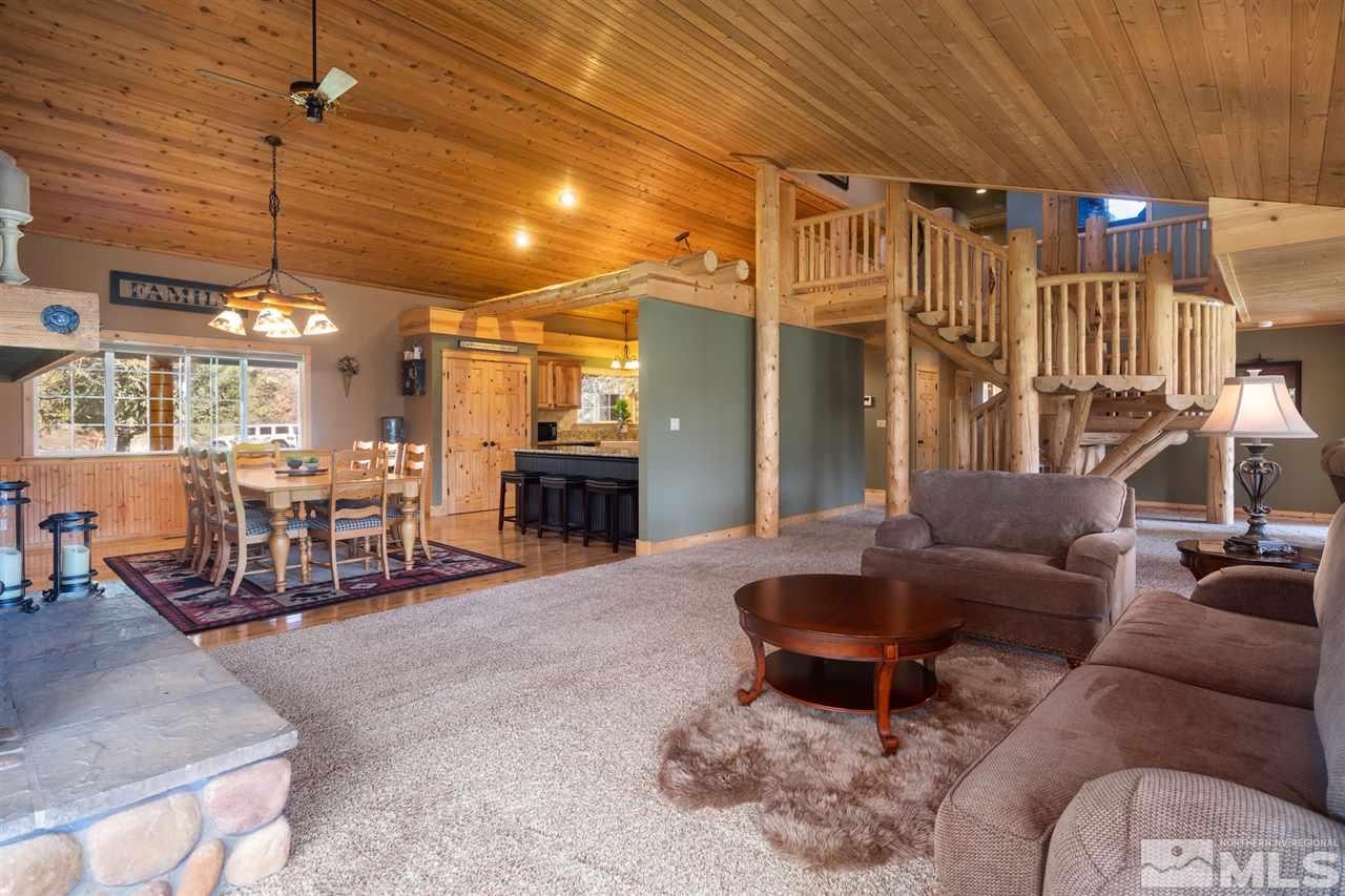 345 Prickly Pear Road Verdi, NV 89439 - Photo 12 of 26 a living room with furniture and a chandelier