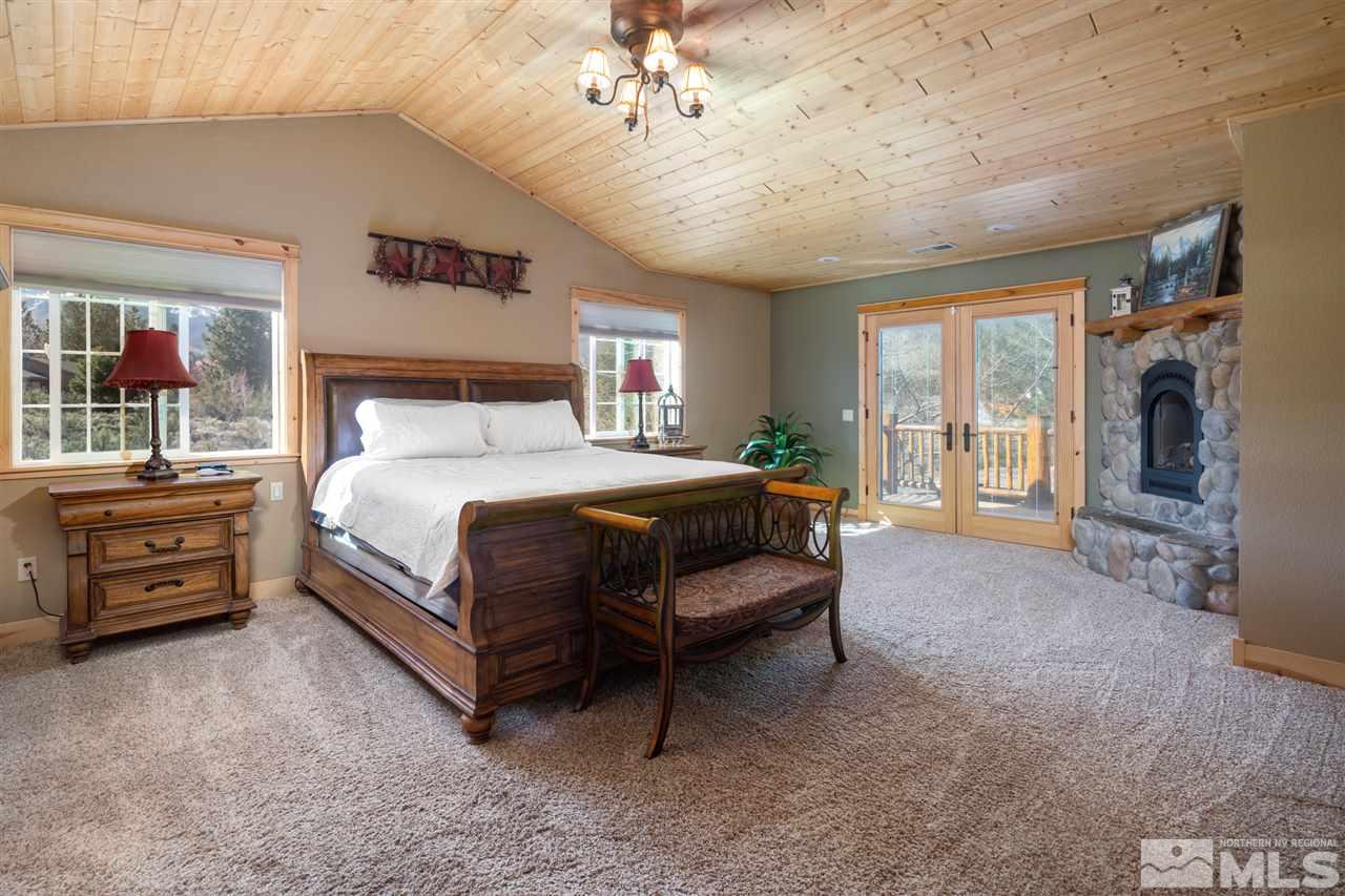 345 Prickly Pear Road Verdi, NV 89439 - Photo 16 of 26 a bedroom with a bed and a tv on dresser