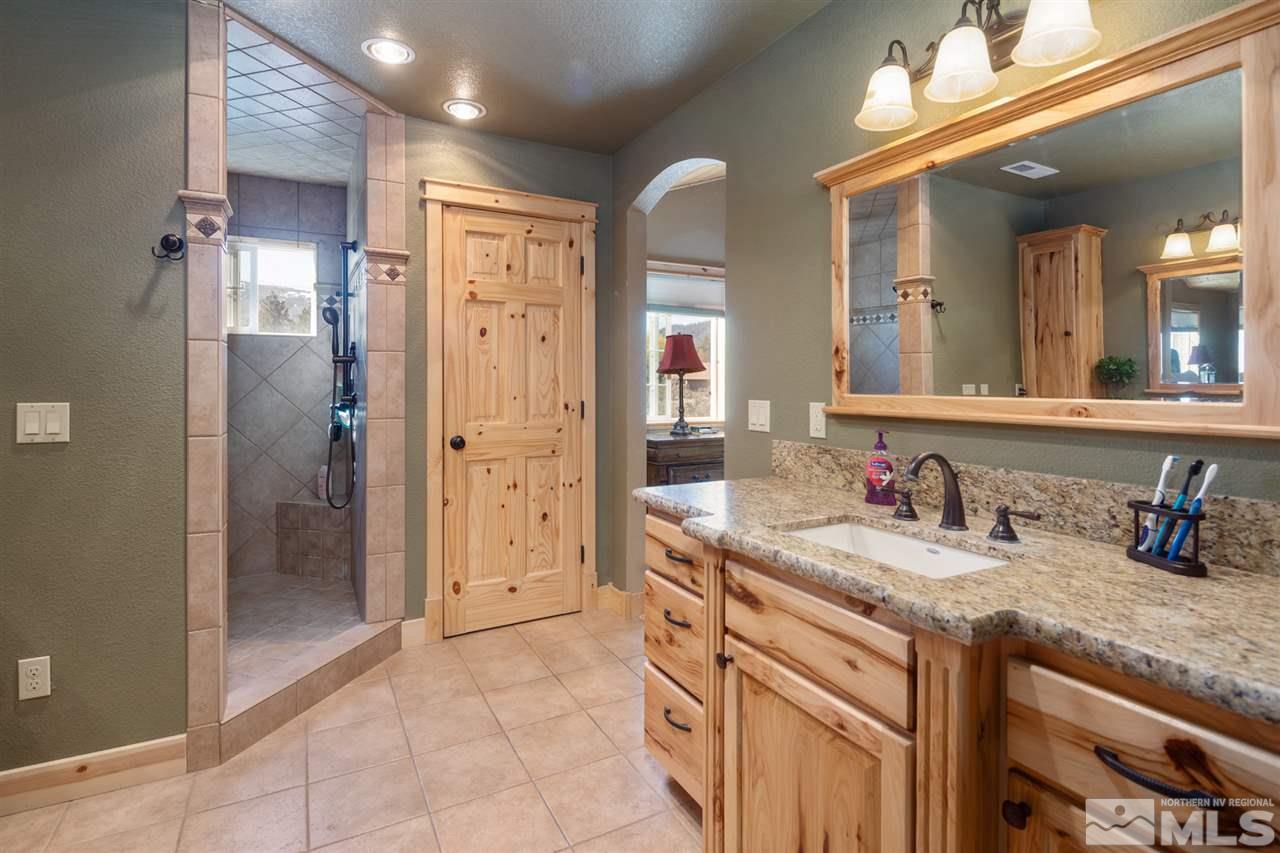 345 Prickly Pear Road Verdi, NV 89439 - Photo 20 of 26 a bathroom with a granite countertop sink mirror and a