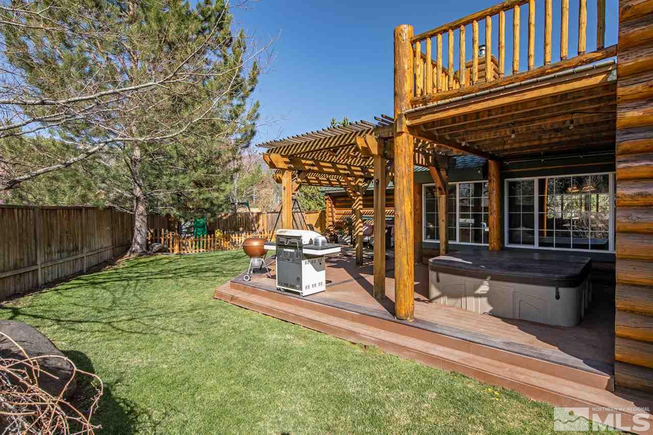 345 Prickly Pear Road Verdi, NV 89439 - Photo 24 of 26 a view of a chairs and table in the back yard of the house