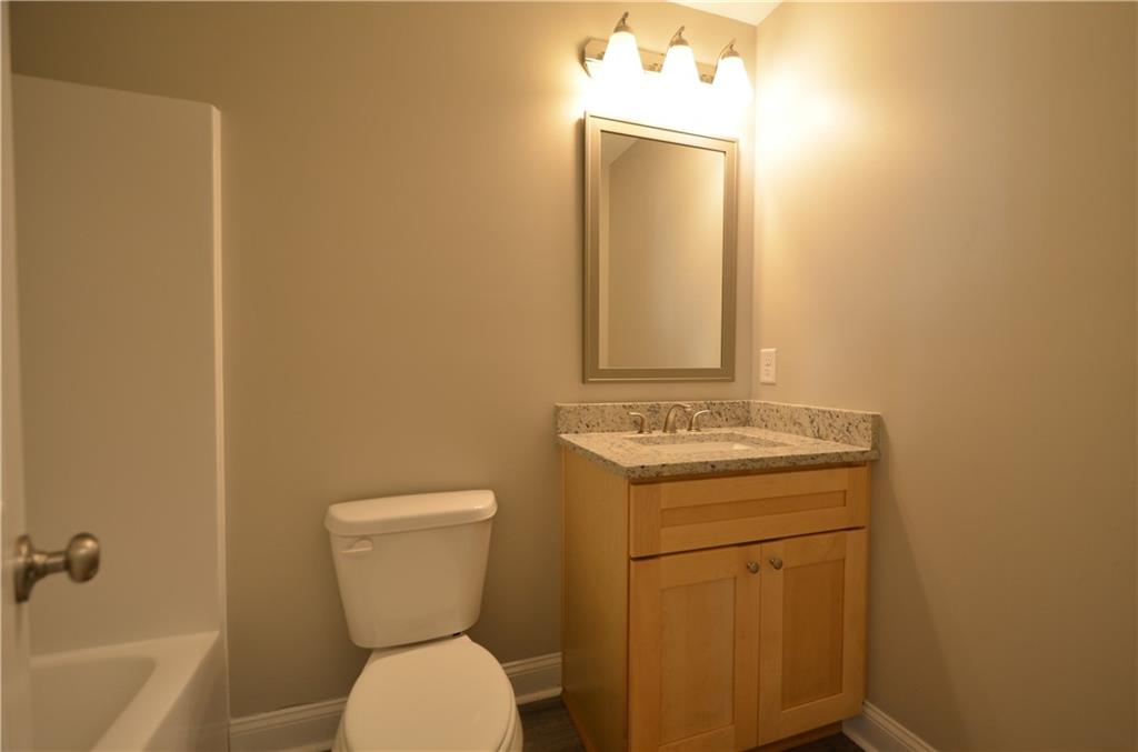 112 Jade Lane Dallas, GA 30132 - Photo 11 of 27 a bathroom with a toilet sink and mirror