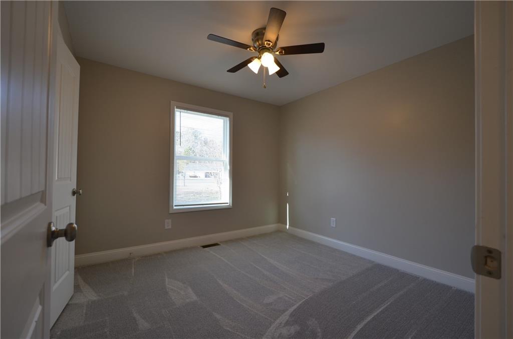 112 Jade Lane Dallas, GA 30132 - Photo 12 of 27 a view of a livingroom with a ceiling fan and window