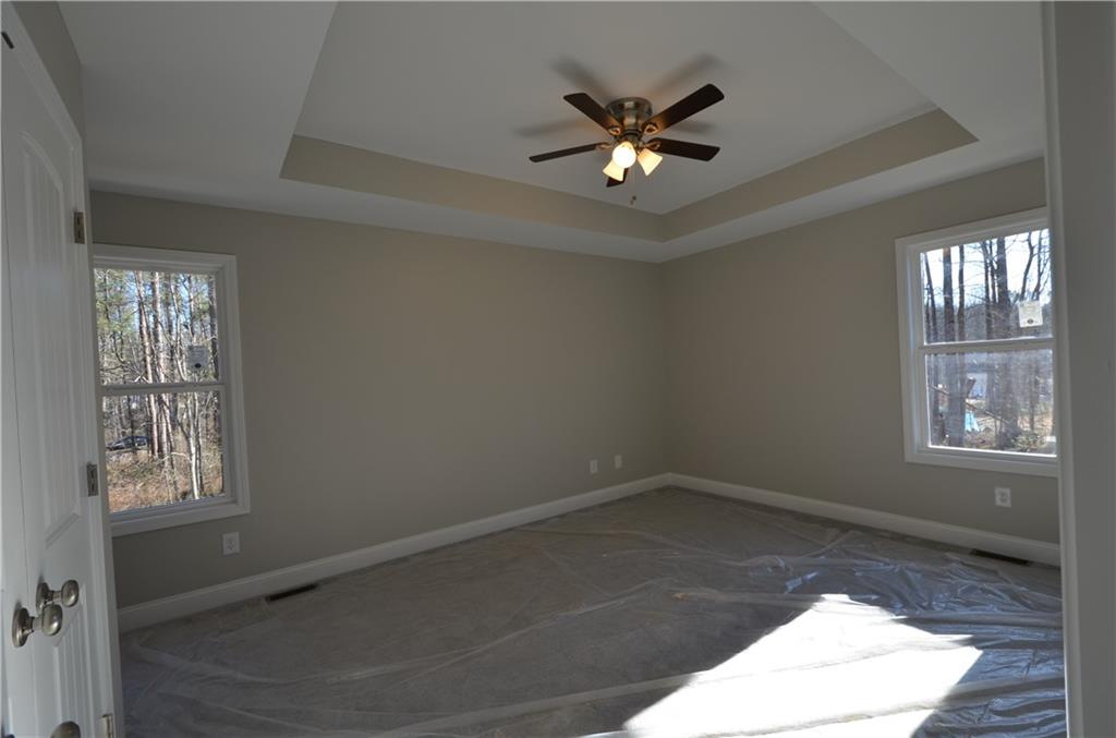 112 Jade Lane Dallas, GA 30132 - Photo 14 of 27 an empty room with windows