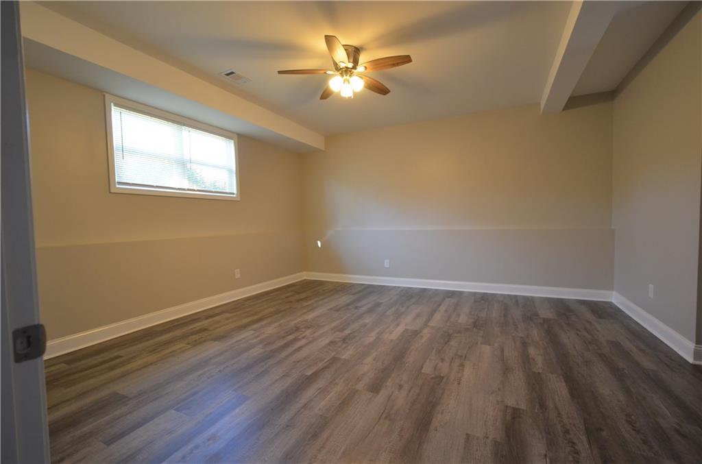 112 Jade Lane Dallas, GA 30132 - Photo 21 of 27 wooden floor in an empty room with a window