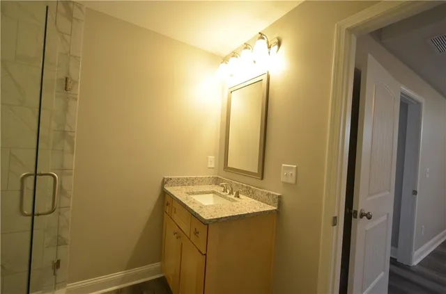 a view of a roof deck with wooden fence and floor