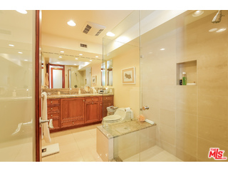 281 South Barrington Avenue, Unit C2 Los Angeles, CA 90049 - Photo 14 of 24 a bathroom with a sink mirror and a shower
