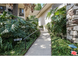 281 South Barrington Avenue, Unit C2 Los Angeles, CA 90049 - Photo 3 of 24 a view of a garden with pathway