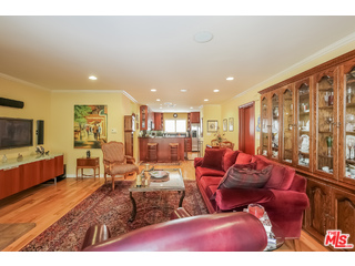 281 South Barrington Avenue, Unit C2 Los Angeles, CA 90049 - Photo 4 of 24 a living room with furniture and a flat screen tv