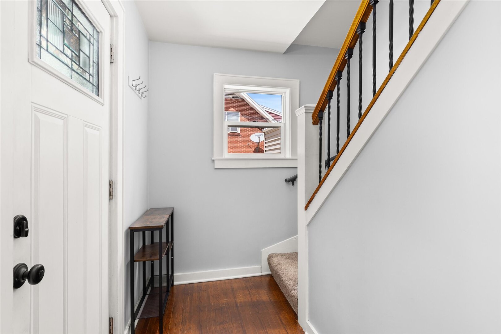 742 Chambers Street Ottawa, IL 61350 - Photo 5 of 39 a view of a hallway with wooden floor and staircase
