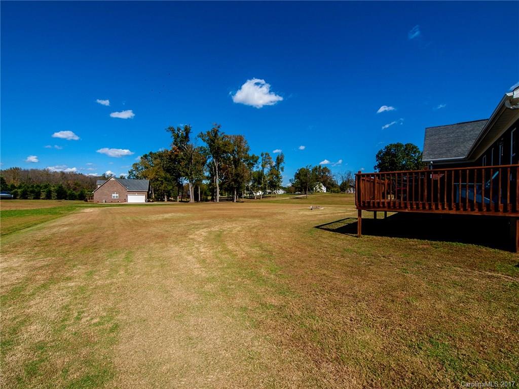 2108 Doster Road, Unit 4 Monroe, NC 28112 - Photo 22 of 24 a view of a swimming pool with an outdoor seating