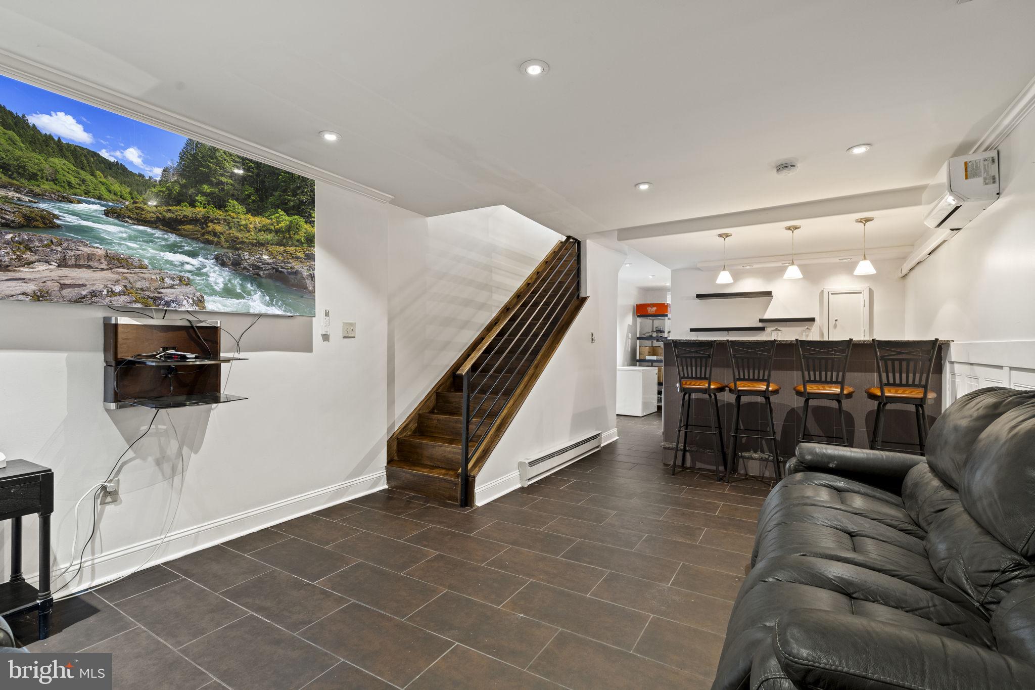 2006 Ellsworth Street Philadelphia, PA 19146 - Photo 14 of 34 a living room with furniture and a flat screen tv