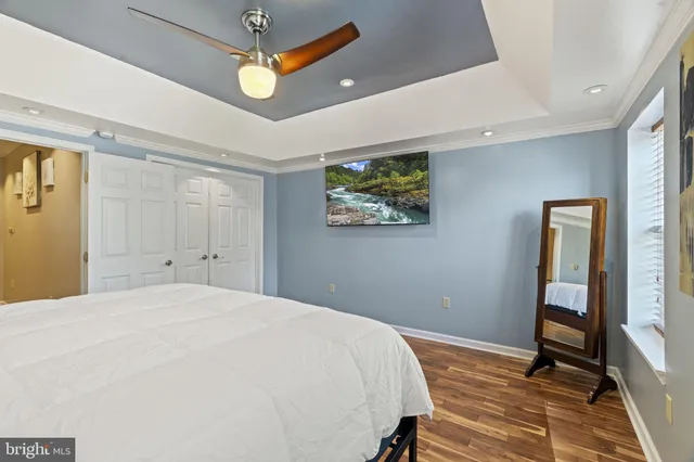a view of hallway with wooden floor and staircase