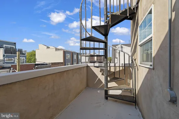 a view of roof deck with seating space
