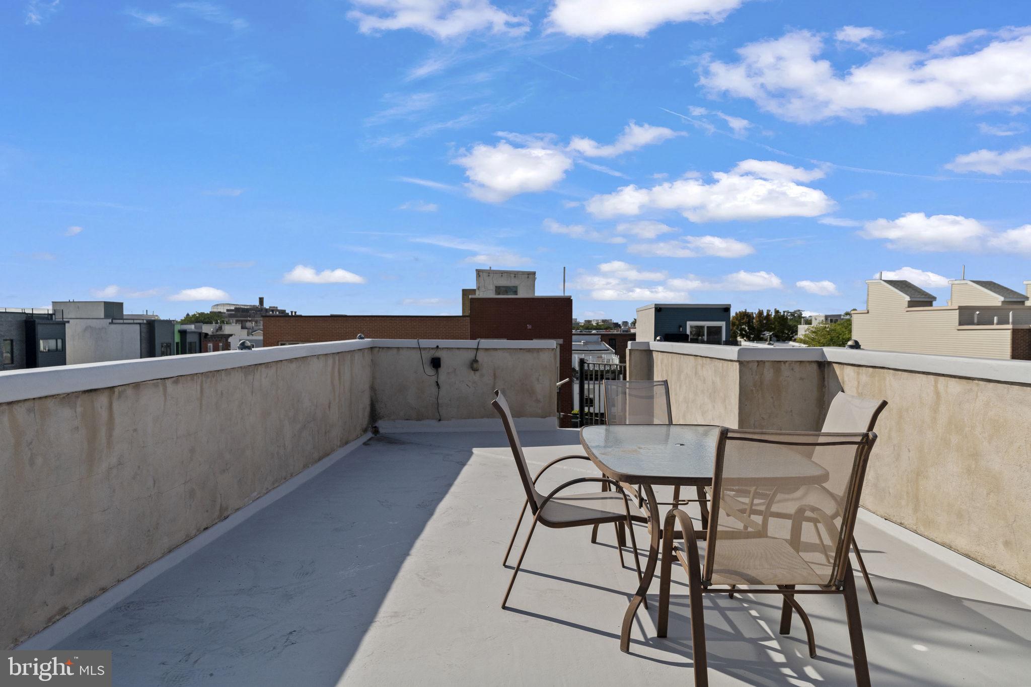 2006 Ellsworth Street Philadelphia, PA 19146 - Photo 32 of 34 a dinning table and chairs with the view of city