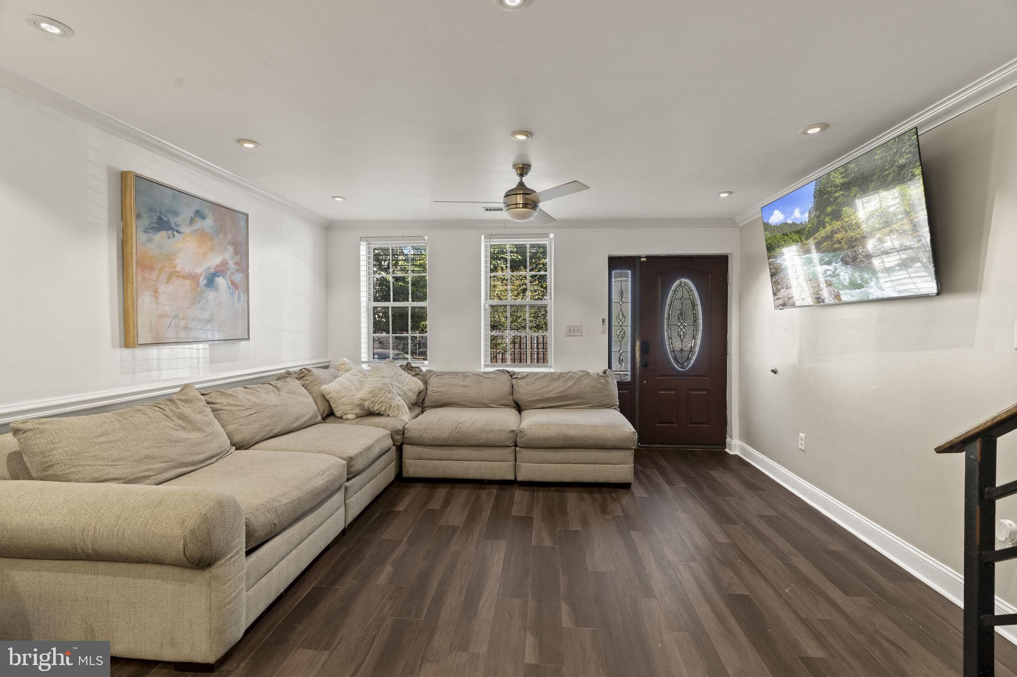 2006 Ellsworth Street Philadelphia, PA 19146 - Photo 6 of 34 a living room with furniture and a flat screen tv