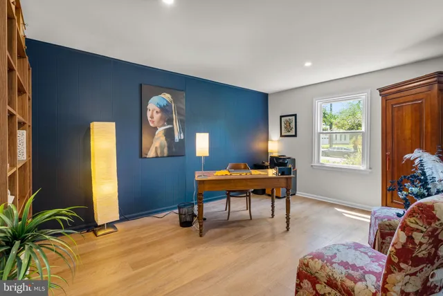 a view of workspace with furniture and window