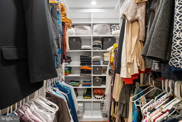 a bathroom with a sink a mirror and shower