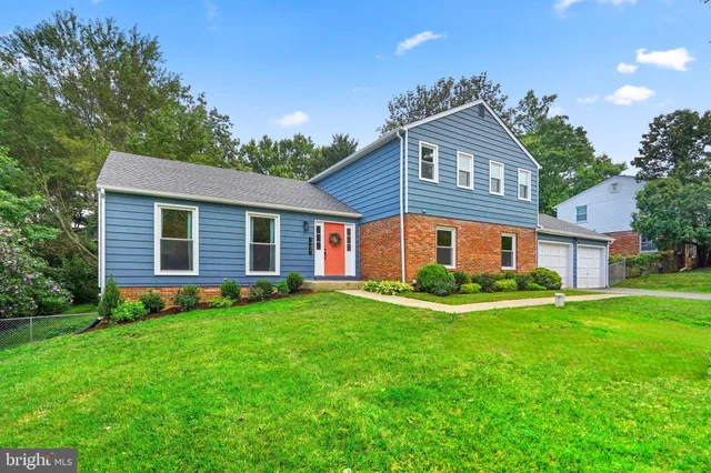 a view of room with furniture and wooden floor