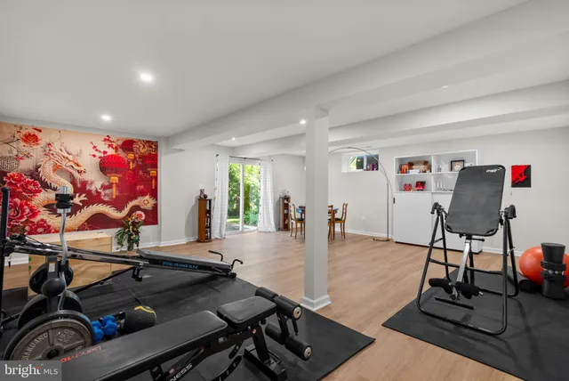 a living room with furniture a dining table and a large window