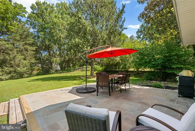 a view of outdoor space with deck and yard