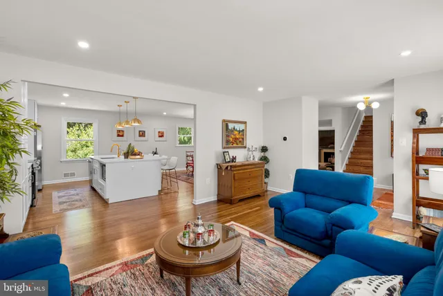 a open kitchen with stainless steel appliances granite countertop a stove and a refrigerator