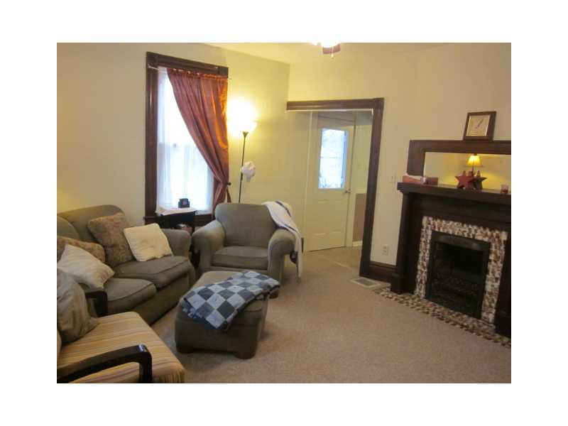 Living Room. Spacious, warm & comfortable living room w/pretty decorative mantel
