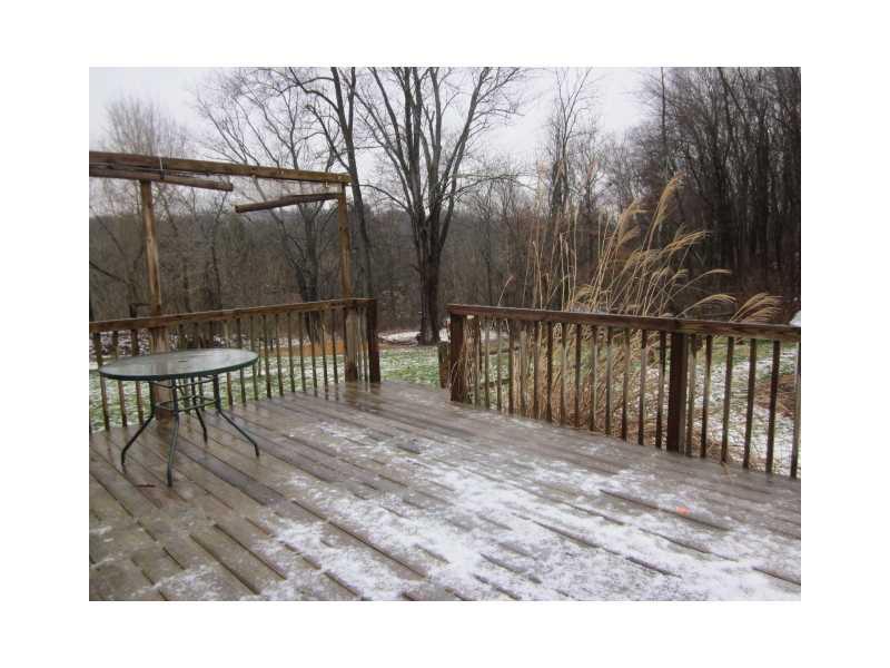 110 Burke Street Rices Landing, PA 15357 - Photo 10 of 14 Patio/Deck. Huge rear deck overlooking swimming pool and rustic woods behind home