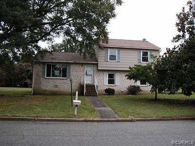 805 Perrymont Road Hopewell, VA 23860 - Photo 1 of 1 a front view of a house with a yard