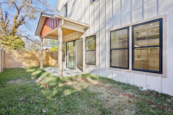 4801 Prock Lane, Unit A Austin, TX 78721 - Photo 12 of 24 a view of a backyard with a garden and brick walls