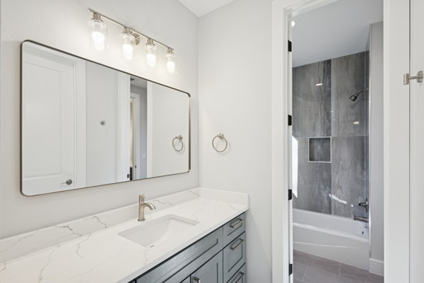 4801 Prock Lane, Unit A Austin, TX 78721 - Photo 15 of 24 a bathroom with a bathtub and a sink