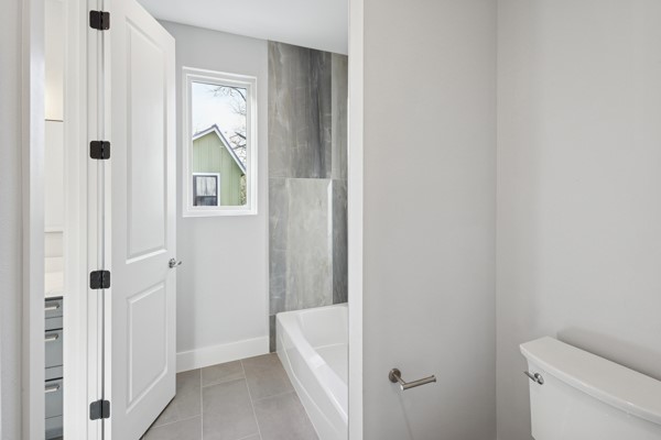 4801 Prock Lane, Unit A Austin, TX 78721 - Photo 16 of 24 a bathroom with a sink and toilet