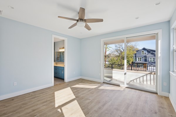 4801 Prock Lane, Unit A Austin, TX 78721 - Photo 20 of 24 a view of a big room with wooden floor and windows