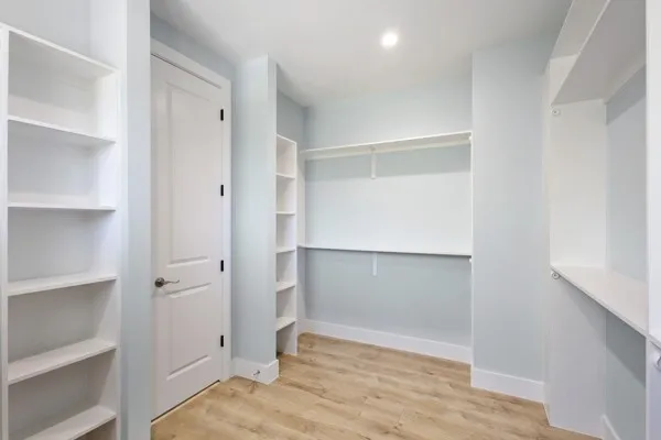 a view of an empty walk in closet
