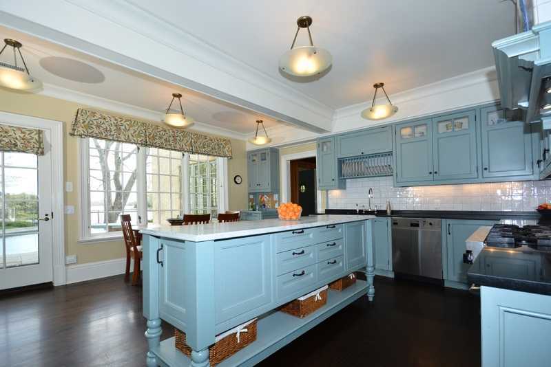 22 Searles Road Darien, CT 06820 - Photo 11 of 25 a kitchen with sink cabinets and window