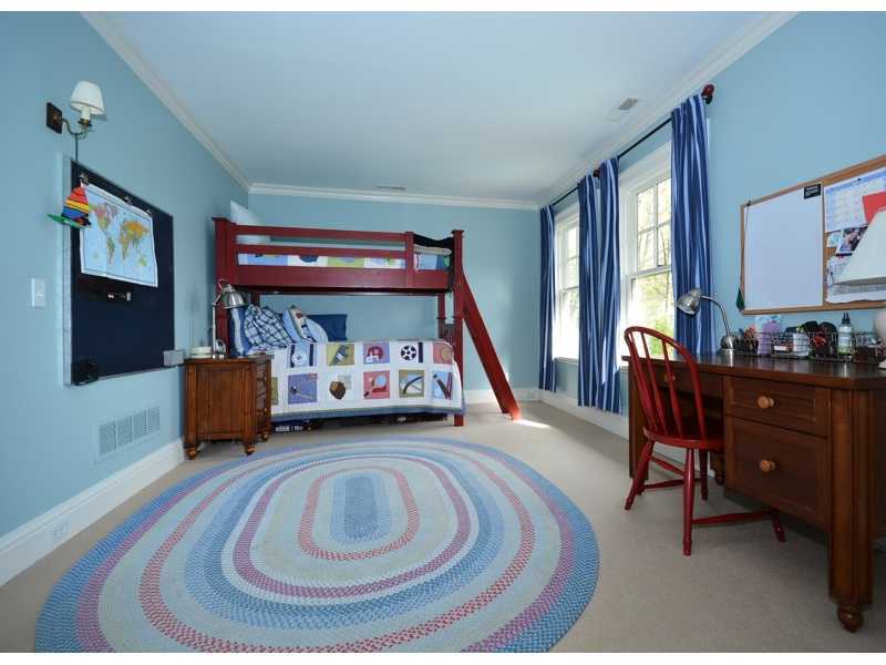 22 Searles Road Darien, CT 06820 - Photo 16 of 25 a bedroom with a bed and a mirror