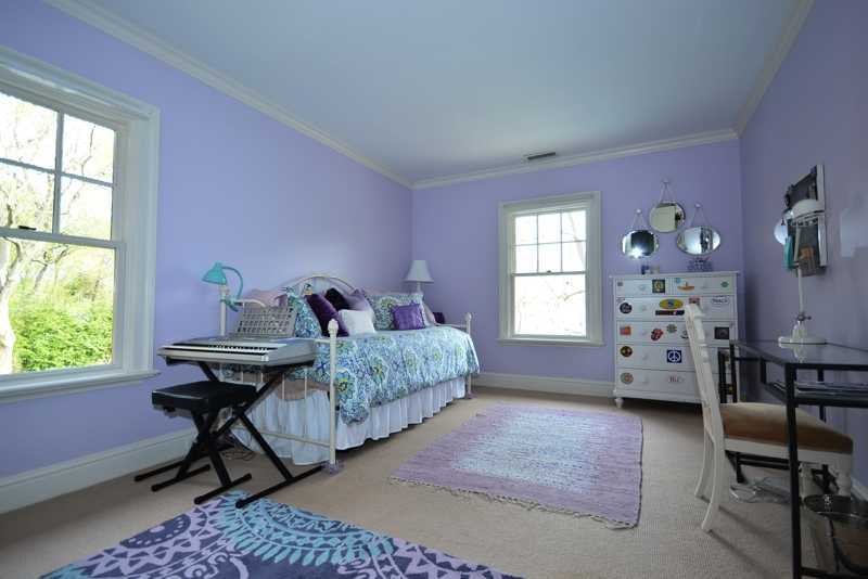 22 Searles Road Darien, CT 06820 - Photo 17 of 25 a bedroom with a bed and a window