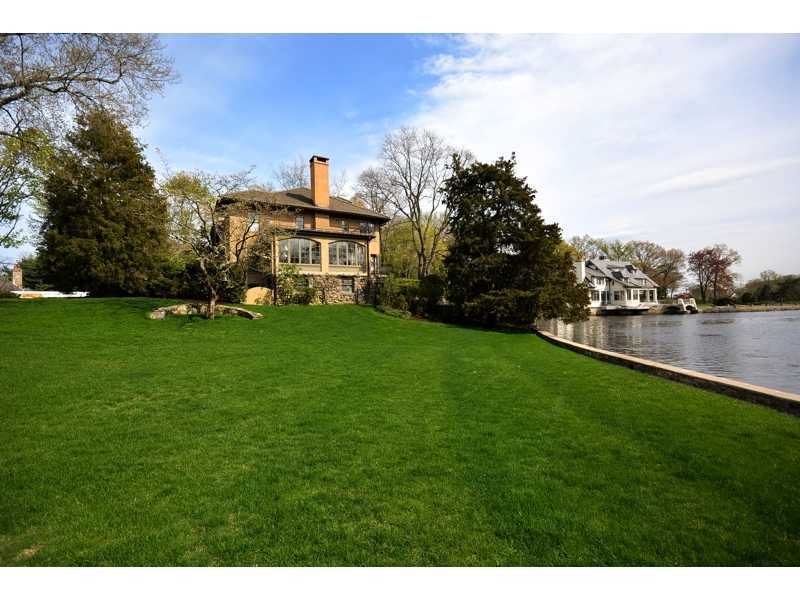22 Searles Road Darien, CT 06820 - Photo 21 of 25 a view of a green field with house in the background