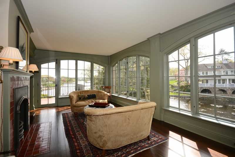 22 Searles Road Darien, CT 06820 - Photo 10 of 25 a living room with fireplace furniture and a large window