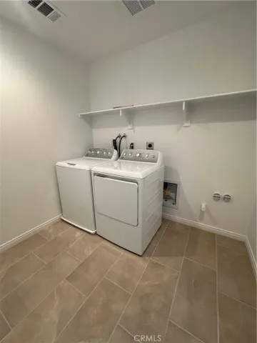 a utility room with washer and dryer