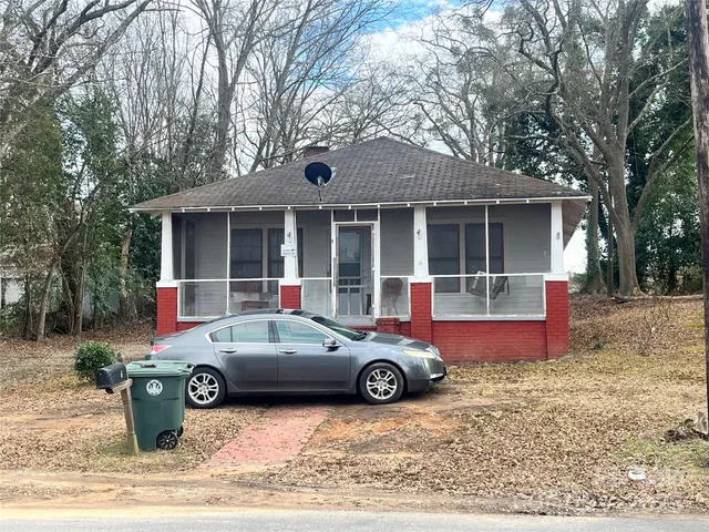 a car parked in front of a house