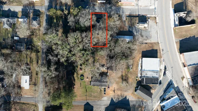 an aerial view of a house with outdoor space