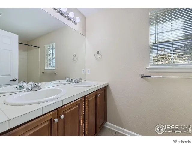 a bathroom with a sink a vanity and a mirror