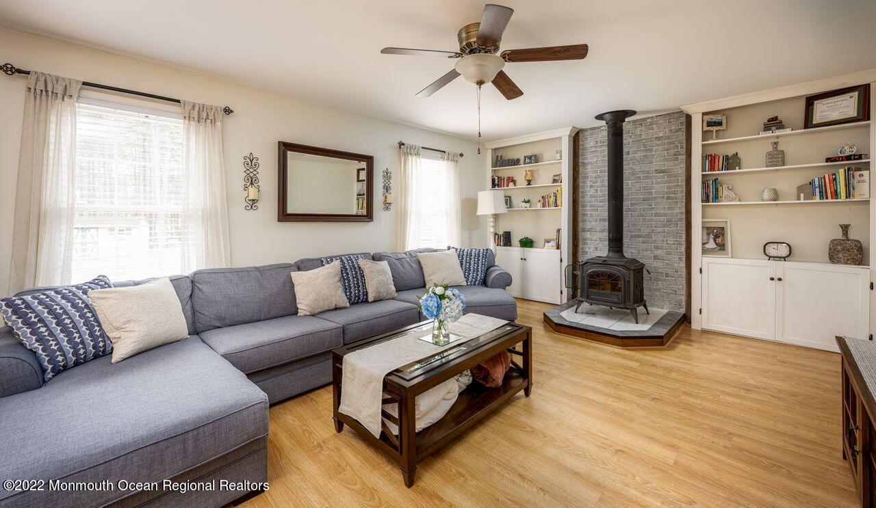 621 Reed Road Jackson, NJ 08527 - Photo 13 of 35 a living room with furniture and a flat screen tv