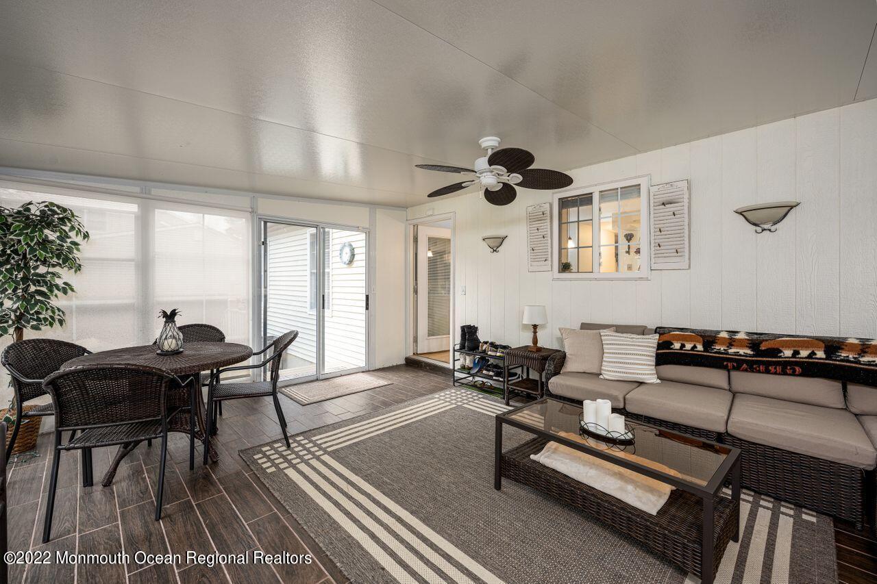 621 Reed Road Jackson, NJ 08527 - Photo 16 of 35 a living room with furniture a rug and a potted plant