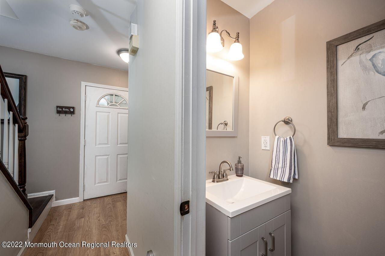 621 Reed Road Jackson, NJ 08527 - Photo 18 of 35 a bathroom with a sink a toilet and mirror