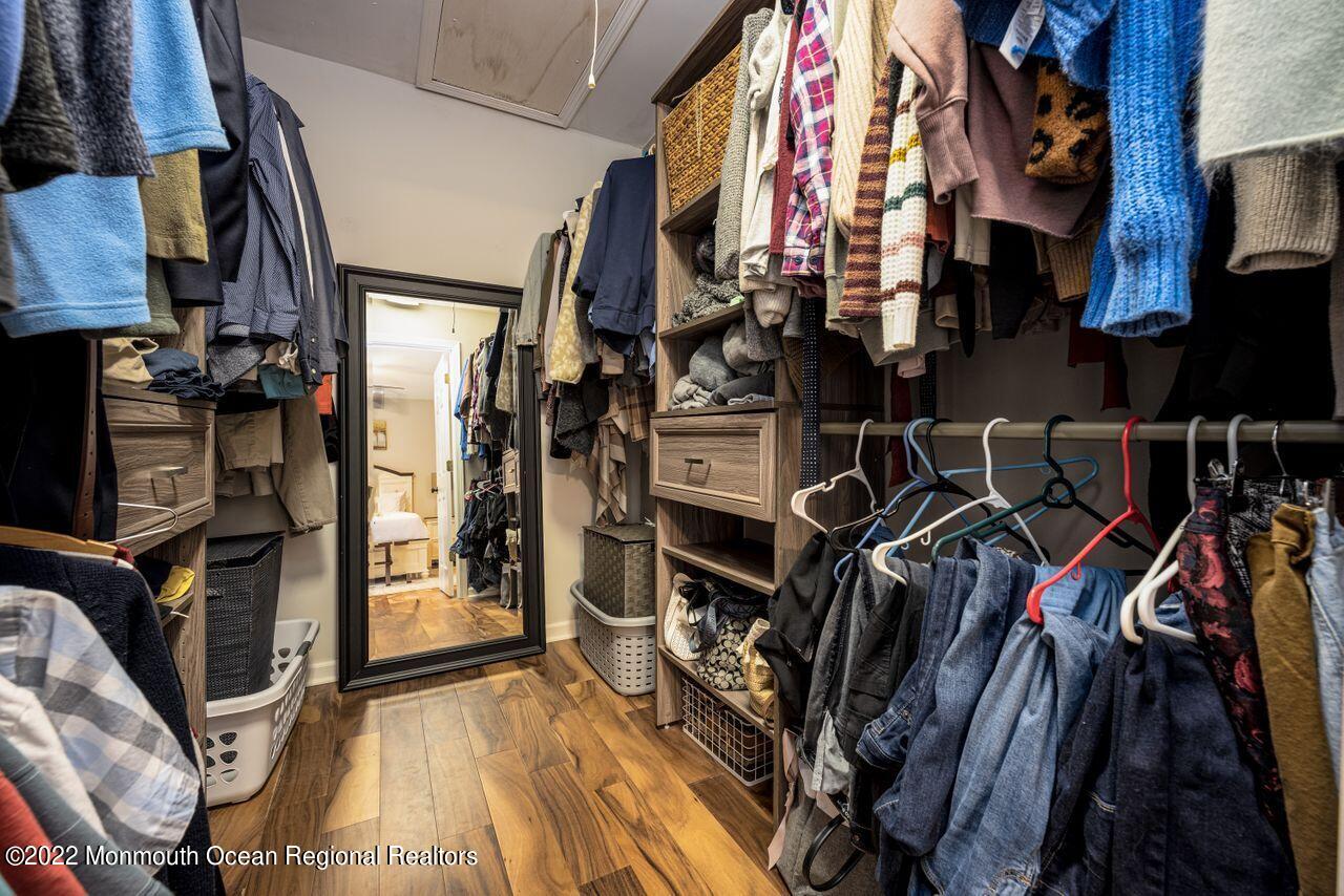 621 Reed Road Jackson, NJ 08527 - Photo 22 of 35 a view of walk in closet with clothes and shoes