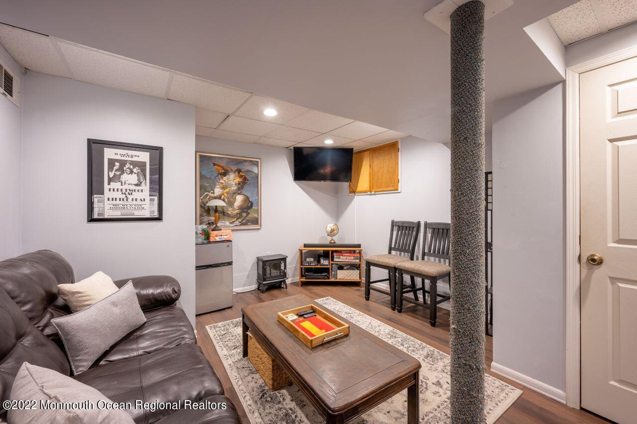 621 Reed Road Jackson, NJ 08527 - Photo 27 of 35 a living room with furniture and a flat screen tv